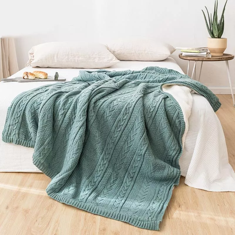 Soft and luxurious Winter Stripe Fleece Blanket with a Nordic striped pattern, perfect for cozying up on cold nights.